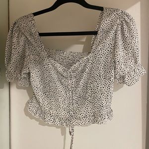 Black and white polka dot puff sleeve crop top